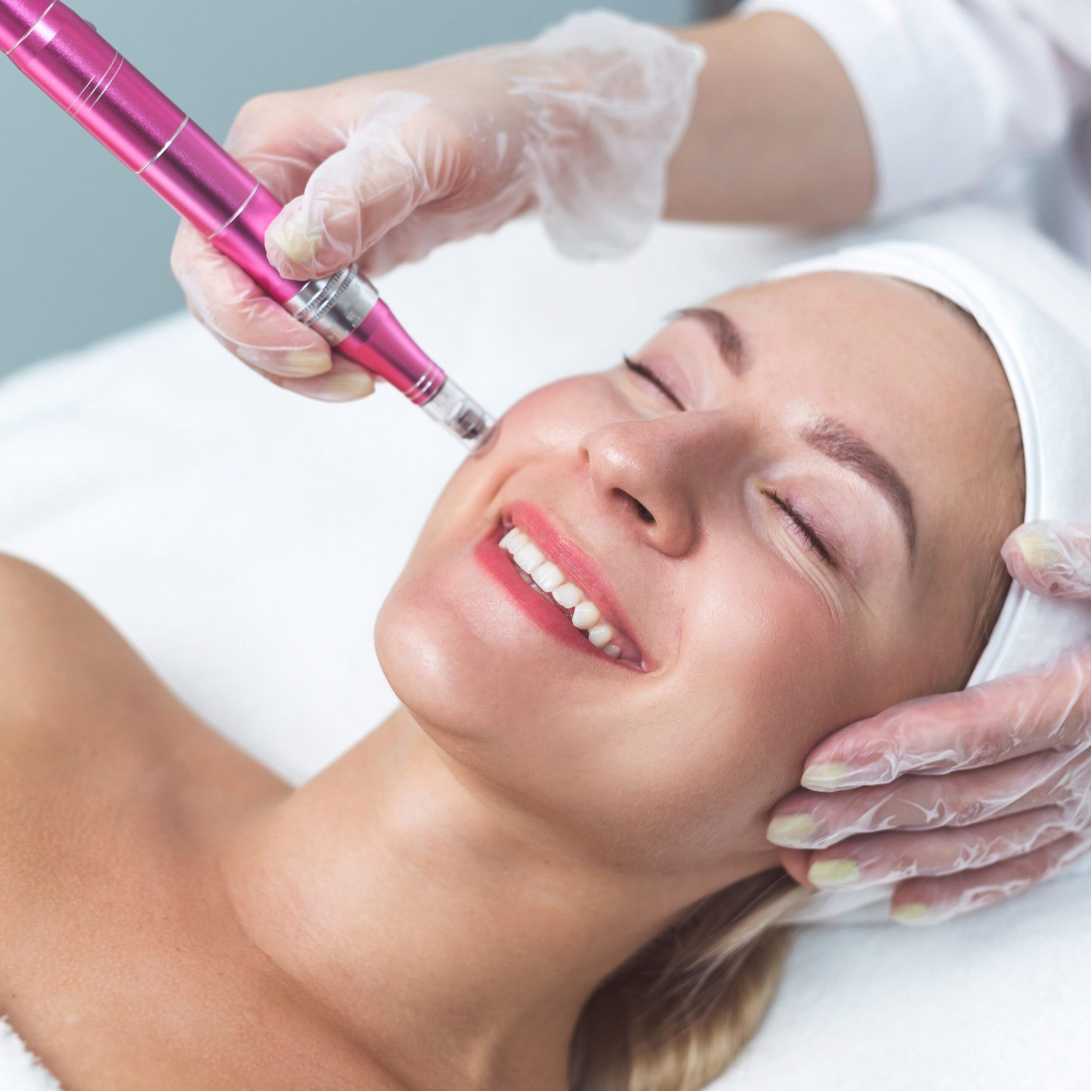 Woman having facial treatment in beauty salon, closeup. Oxy derma therapy with derma pen