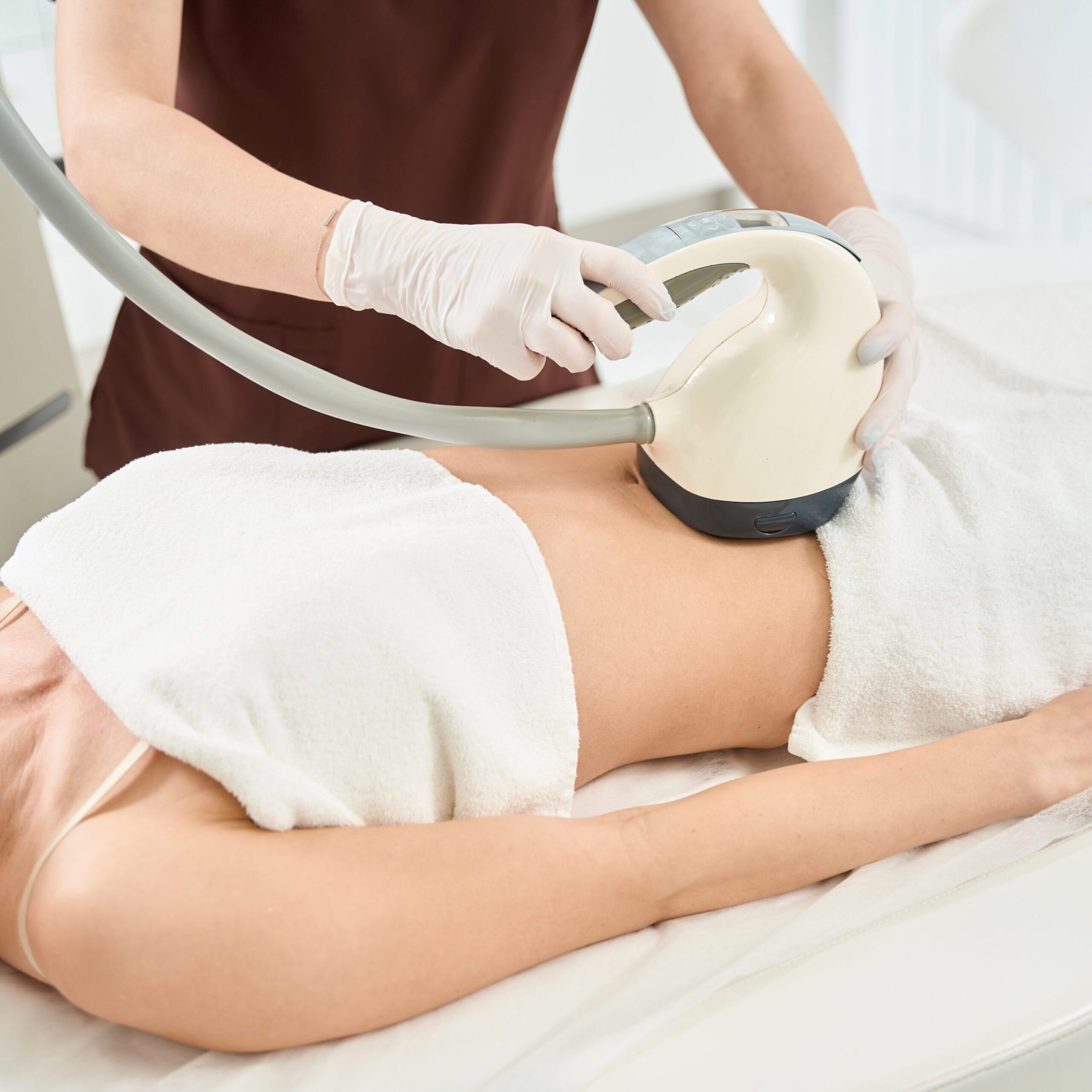 Woman attending cellulite reduction treatment with velashape apparatus Woman attending cellulite reduction treatment with velashape apparatus that stimulating growth of new and better collagen and elastin which results in localized reduction in skin laxity, body volume